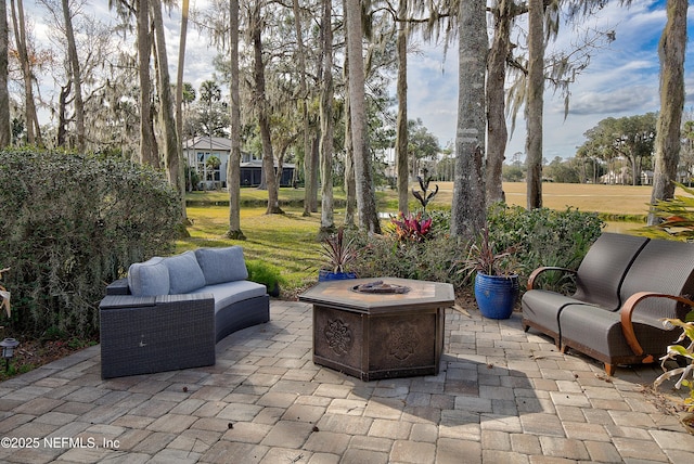 view of patio / terrace featuring an outdoor living space with a fire pit