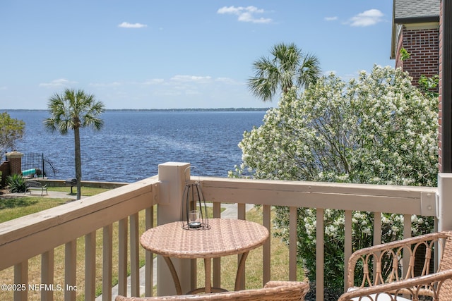 balcony featuring a water view