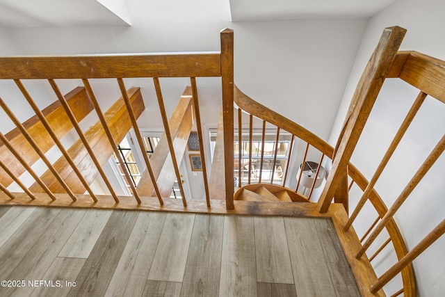 stairs featuring wood-type flooring