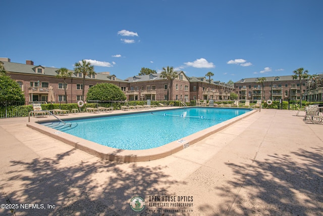 view of pool featuring a patio