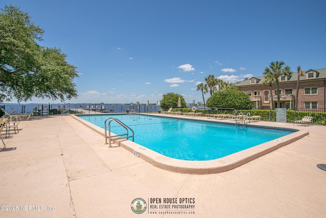 view of swimming pool with a patio