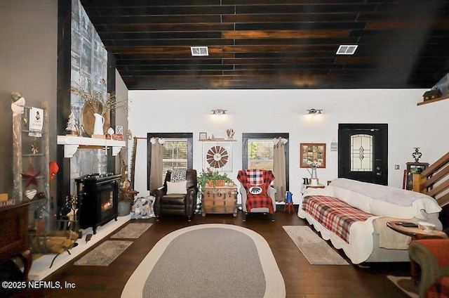 interior space with a fireplace and dark hardwood / wood-style flooring