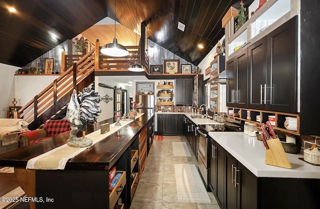 kitchen with pendant lighting, stainless steel range with electric stovetop, a center island, wooden ceiling, and a barn door