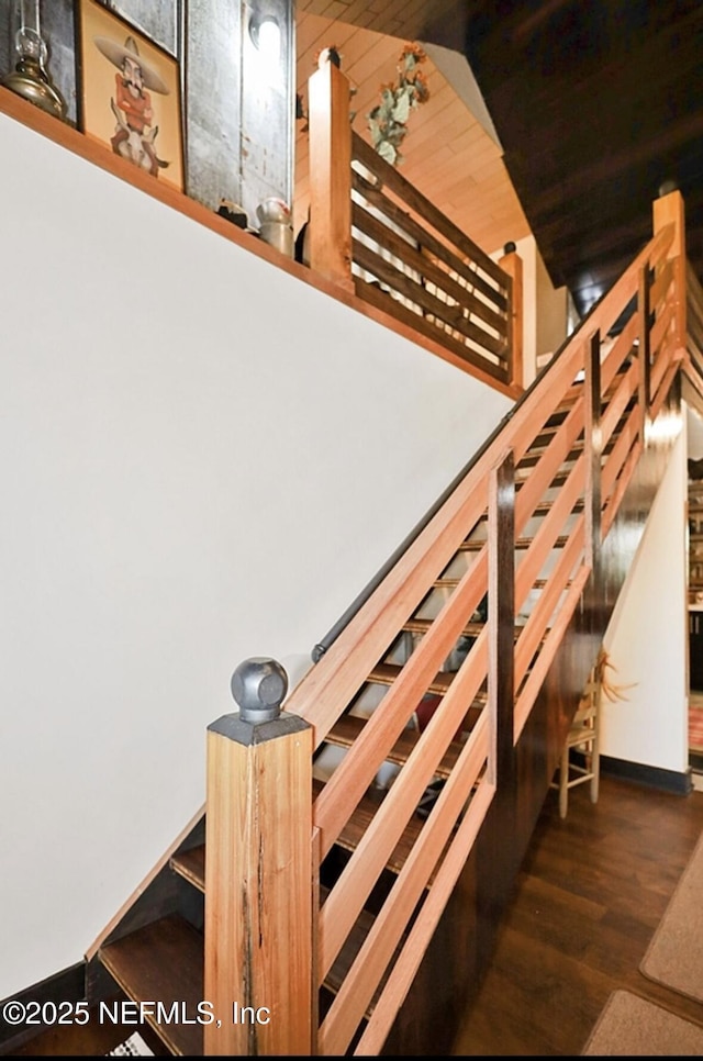 stairs with hardwood / wood-style floors