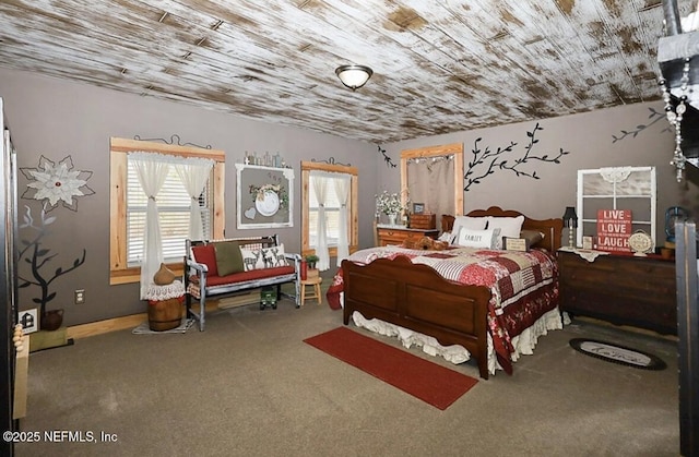 bedroom with carpet floors and wood ceiling