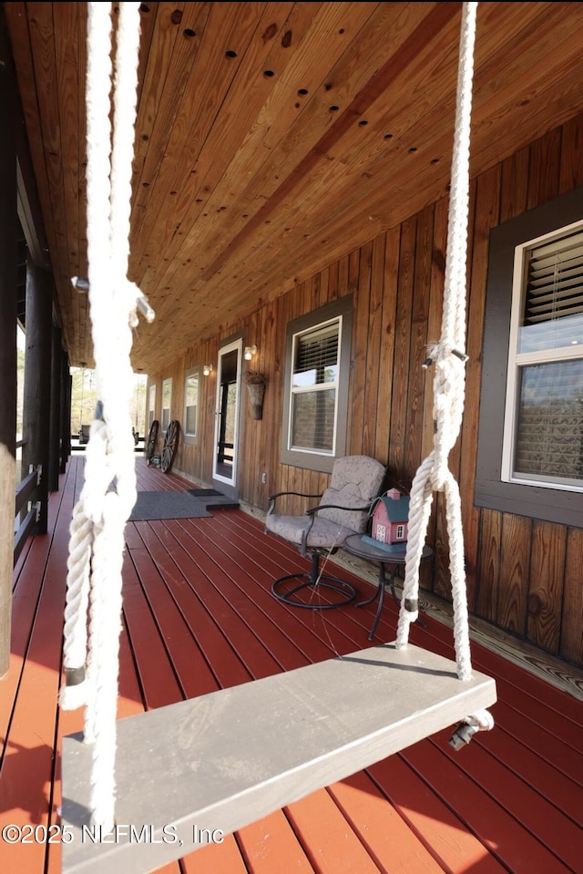 wooden deck featuring covered porch