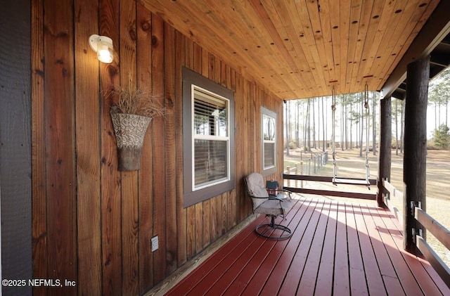 wooden deck featuring covered porch