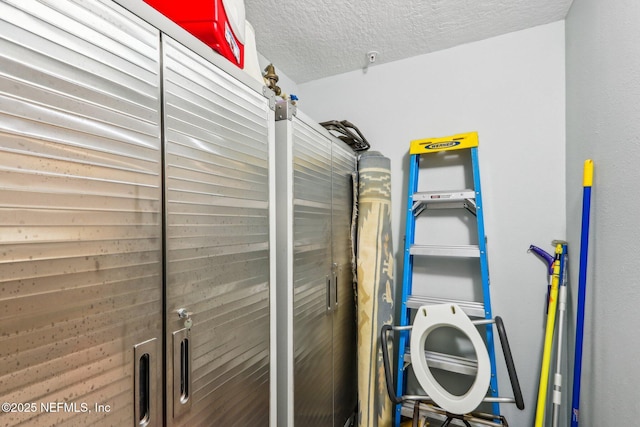 laundry area featuring a textured ceiling