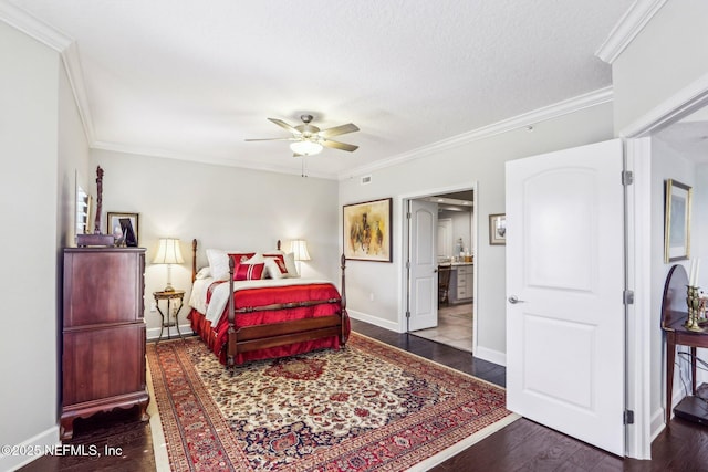 bedroom featuring ornamental molding, dark wood-type flooring, connected bathroom, and a textured ceiling