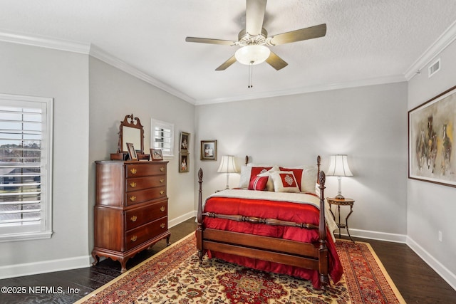 bedroom featuring ornamental molding, ceiling fan, a textured ceiling, and dark hardwood / wood-style flooring