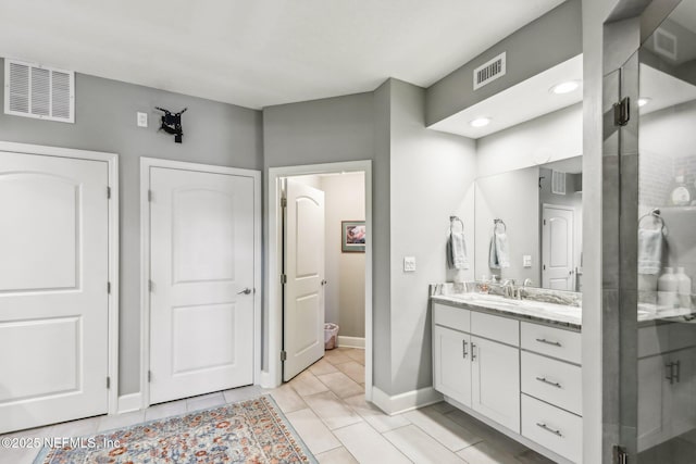 bathroom with vanity and an enclosed shower