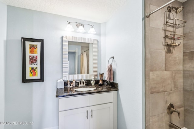 bathroom with vanity, a textured ceiling, and shower / bath combo with shower curtain