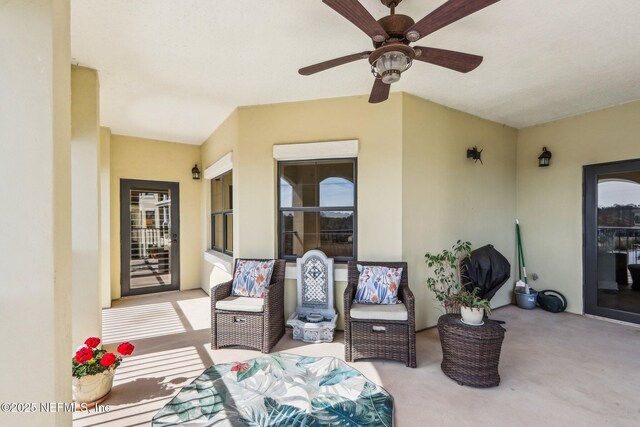 view of patio featuring ceiling fan