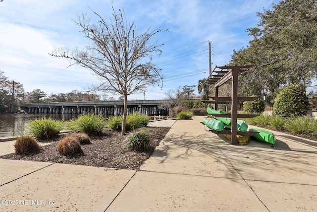 surrounding community featuring a pergola and a playground