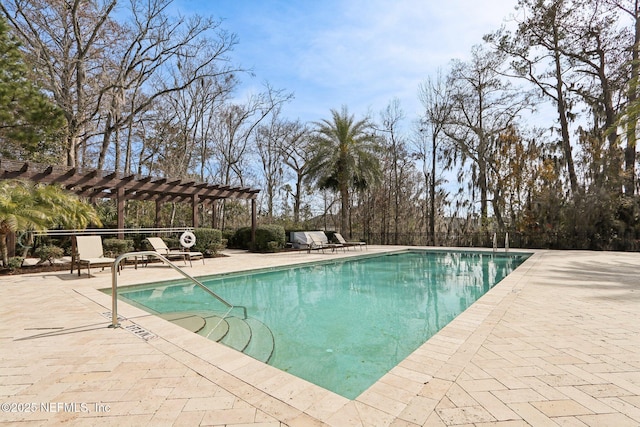 view of pool with a pergola and a patio