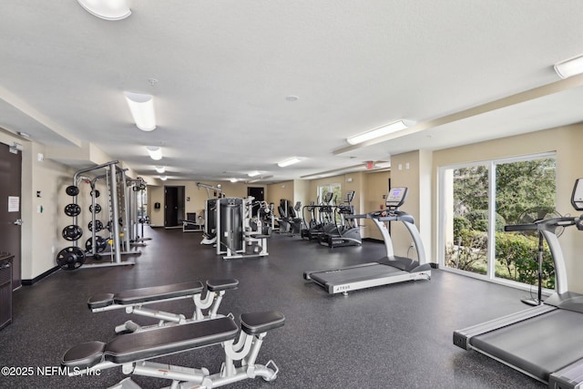 exercise room featuring a textured ceiling