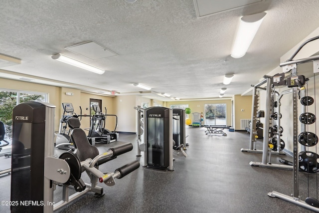 gym with a textured ceiling