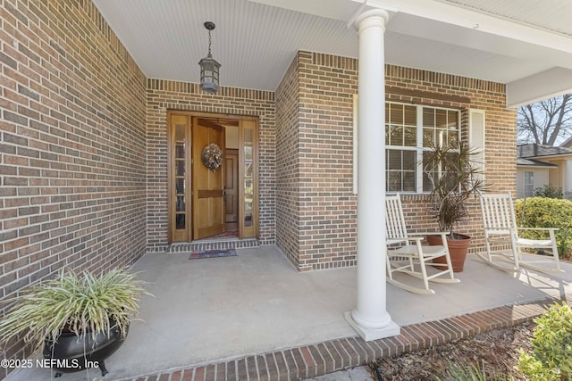 property entrance featuring covered porch