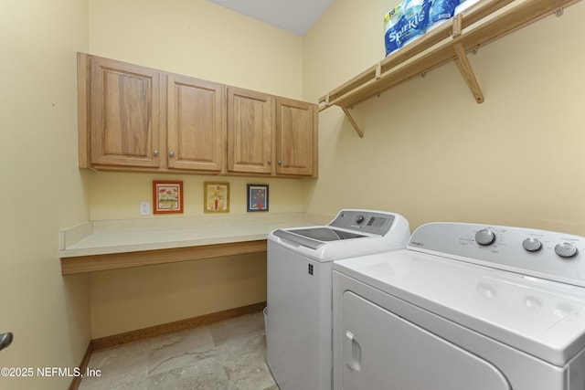 laundry area with cabinets and separate washer and dryer