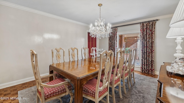 dining space with ornamental molding, dark parquet flooring, and a chandelier