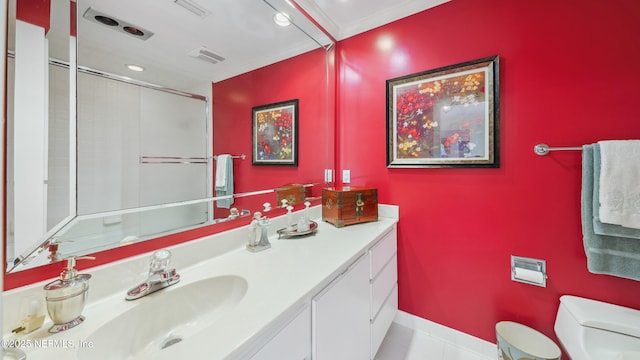 bathroom with crown molding, vanity, an enclosed shower, tile patterned floors, and toilet