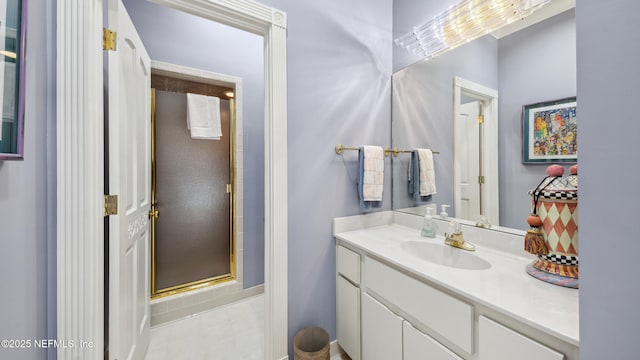 bathroom featuring an enclosed shower and vanity