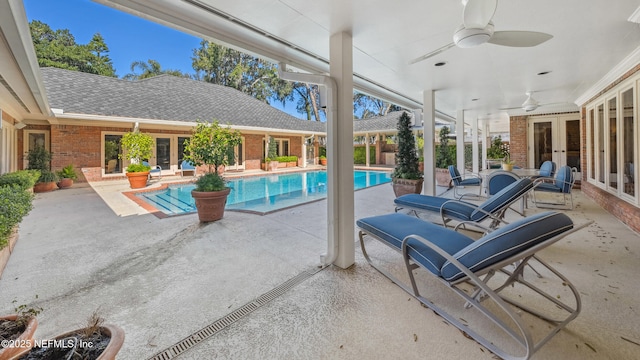 view of pool with a patio area, ceiling fan, and french doors