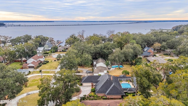 aerial view at dusk with a water view