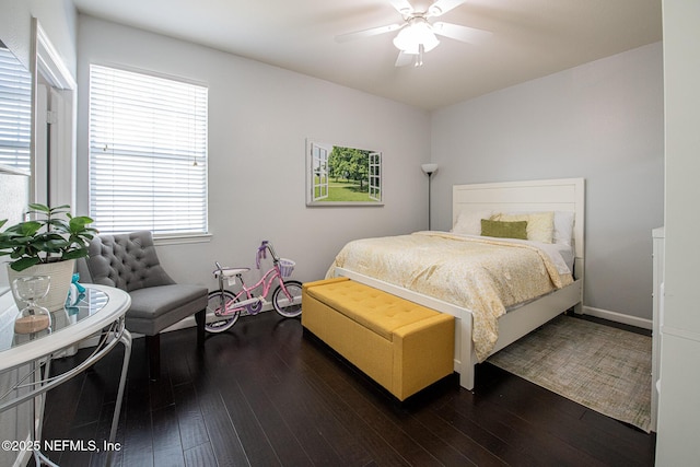 bedroom with dark wood-type flooring and ceiling fan