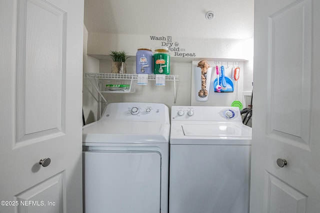 washroom featuring washer and clothes dryer