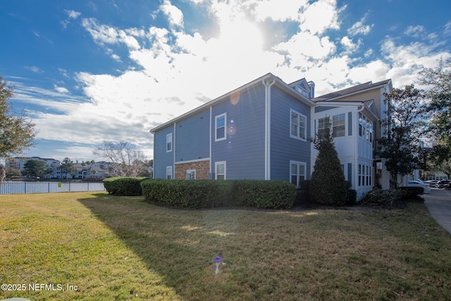 view of side of property featuring a yard