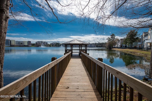 dock area with a gazebo and a water view