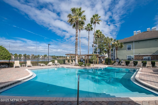 view of swimming pool with a pergola and a patio