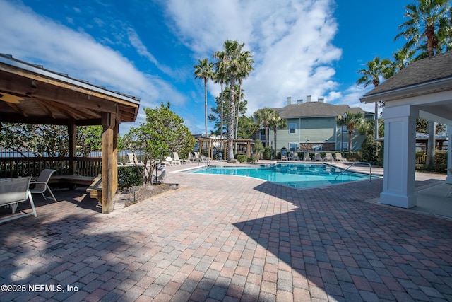 view of swimming pool with a patio