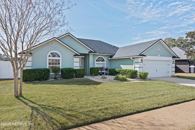 ranch-style house featuring a garage and a front yard