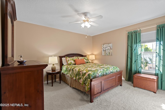 bedroom with light colored carpet and ceiling fan