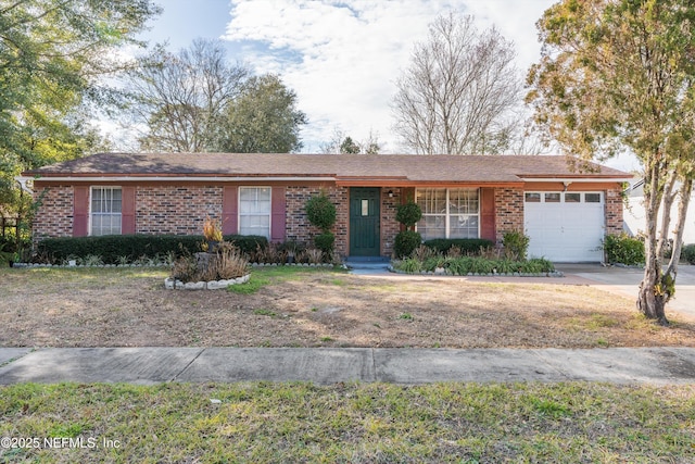 single story home featuring a garage and a front yard