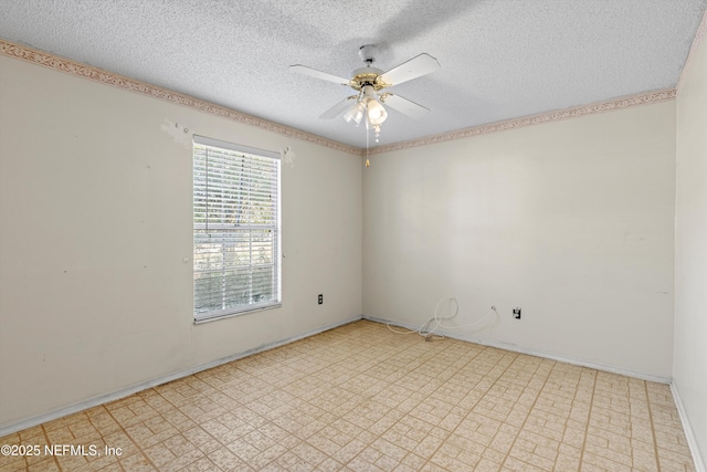 unfurnished room featuring ceiling fan and a textured ceiling