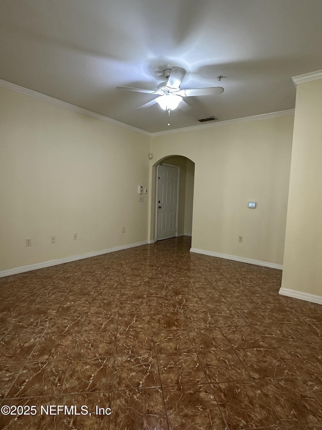 unfurnished room with ceiling fan and ornamental molding