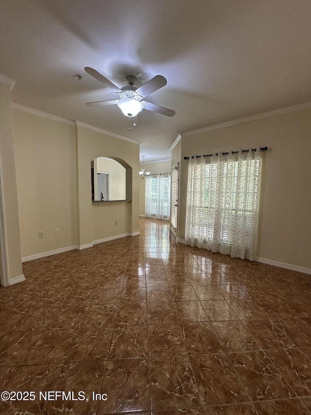 empty room with crown molding and ceiling fan with notable chandelier