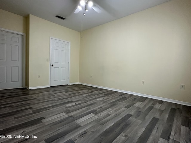 unfurnished bedroom with dark hardwood / wood-style floors and ceiling fan