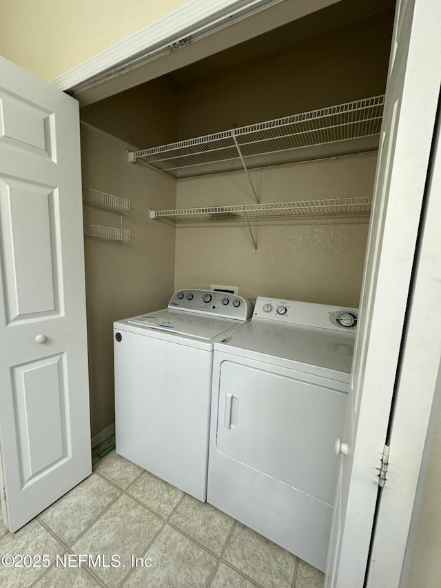 laundry room featuring separate washer and dryer