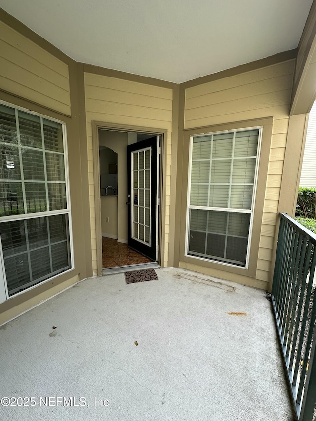 property entrance with a balcony