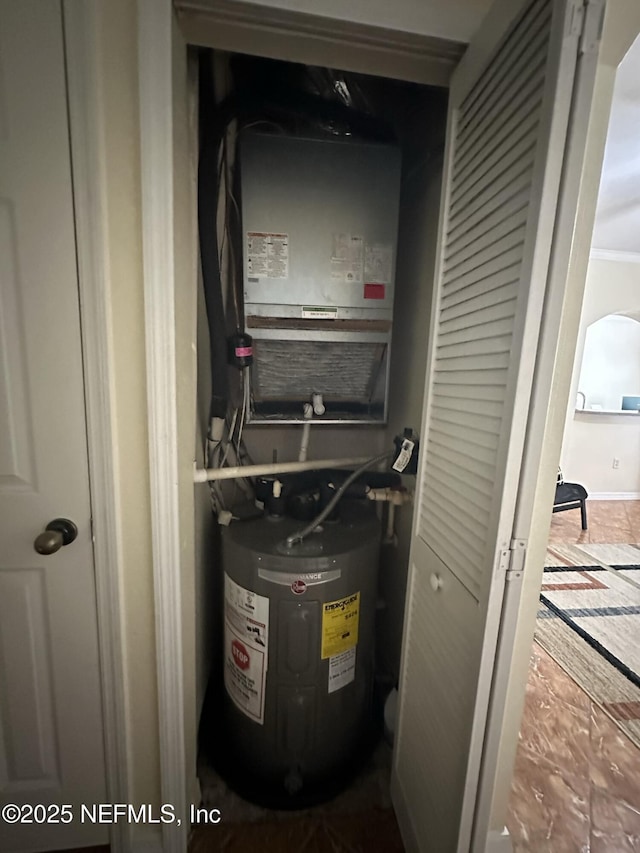 utility room with electric water heater