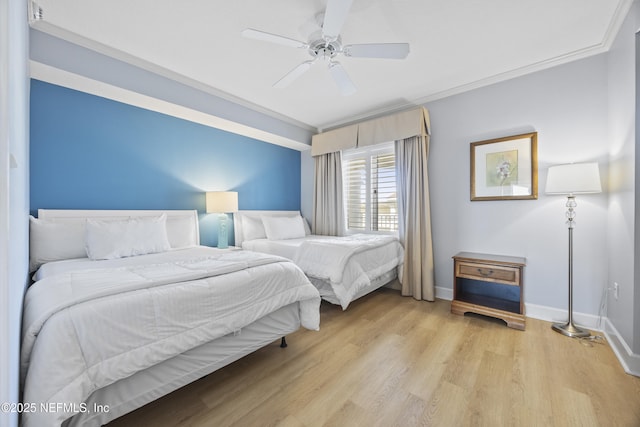 bedroom with crown molding, ceiling fan, and light hardwood / wood-style floors