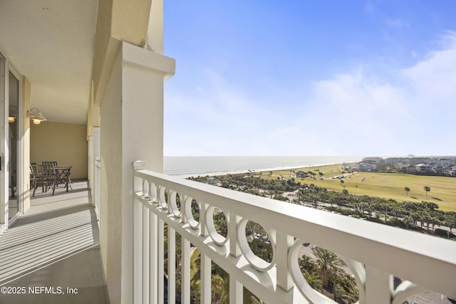 balcony featuring a water view