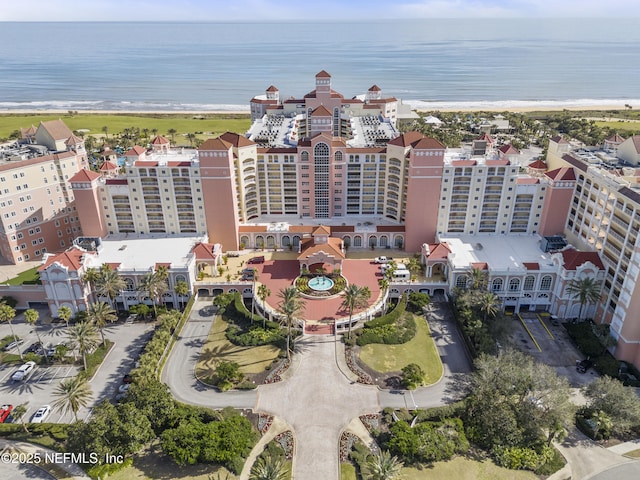 birds eye view of property with a view of the beach and a water view