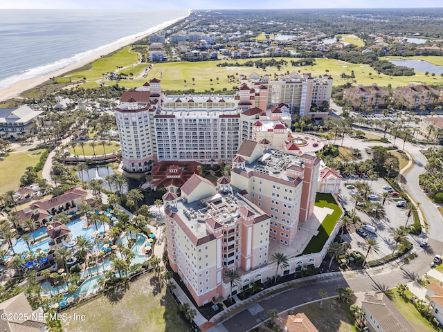 birds eye view of property featuring a water view and a view of the beach