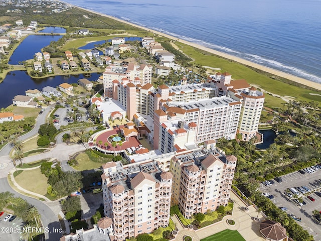 bird's eye view featuring a water view and a view of the beach