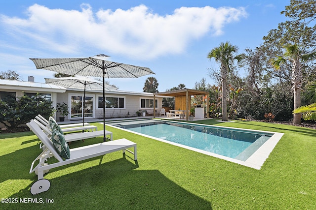 view of pool with a patio, a pergola, and a lawn